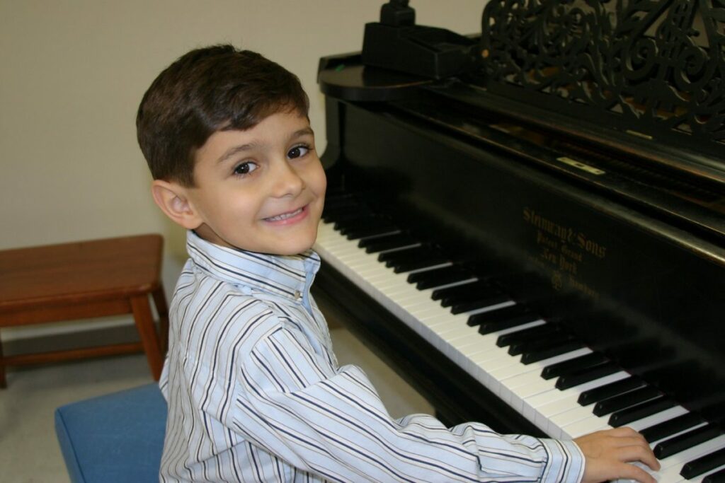child playing piano - music lessons san antonio